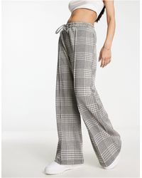 New Look - Pantaloni con fondo ampio, colore marrone a quadri - Lyst