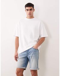 ASOS - Pantalones Cortos Vaqueros Azules Elásticos De Corte Slim Y Largo Estándar Con Lavado Claro De - Lyst