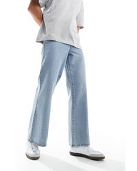ASOS - Jeans a zampa a fondo ampio lavaggio medio - Lyst