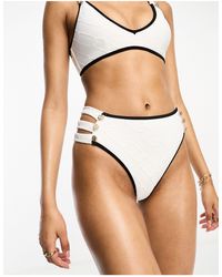 River Island - Slip bikini a vita alta testurizzati bianchi con cut-out e bottoni - Lyst