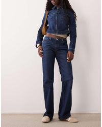 GOOD AMERICAN - Ghost Waist Low Rise Bootcut Jeans - Lyst