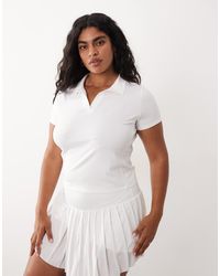 4505 - Curve - polo style tennis à manches courtes - Lyst
