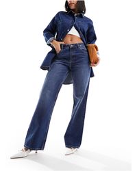 Bershka - Jeans a fondo ampio e vita alta anni '90 lavaggio indaco - Lyst