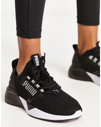 PUMA - Training retaliate - sneakers nere e bianche - Lyst