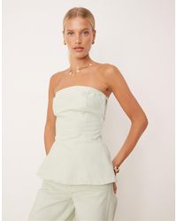 Mango - Top bandeau en jean doux d'ensemble à basque avec fermeture éclair sur le côté - pastel - Lyst