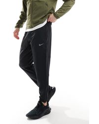 Nike - Joggers s dri-fit challenger - Lyst