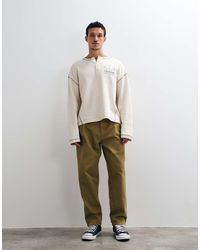 ASOS - Relaxed Tapered Pants With Belt And Pleats - Lyst
