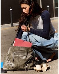 Bershka - Leather Effect Bucket Bag With Buckles - Lyst