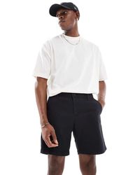 ASOS - Pantalones Cortos Chinos Negros De Largo Medio Y Corte Pitillo De - Lyst