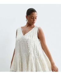 ARRANGE - Curve All Over Fringe Longline Peplum Top - Lyst