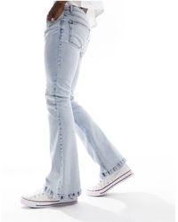 ASOS - Jeans a zampa elasticizzato lavaggio chiaro - Lyst