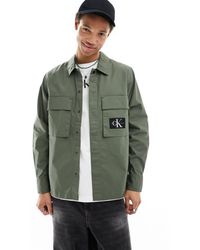 Calvin Klein - Camicia giacca multitasche color oliva - Lyst