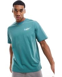 Nike - T-shirt scuro con logo sul petto - Lyst