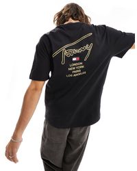 Tommy Hilfiger - T-shirt unisex nera con firma classica del logo oro sul retro - Lyst