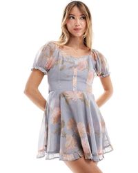 Miss Selfridge - Gelaagde Playsuit Van Chiffon Met Rara-Rok, Strik Op De Rug En Bloemen - Lyst