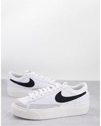 Nike basse clearance nere e bianche