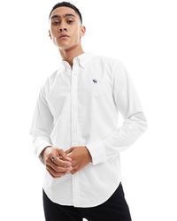 Abercrombie & Fitch - Camisa oxford blanca con logo icon - Lyst