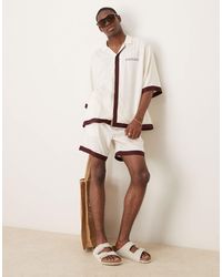 ASOS - Short d'ensemble mi-long avec bordures imprimées - beige - Lyst