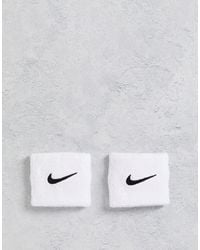 Nike - Training - fasce da polso unisex bianche con logo - Lyst