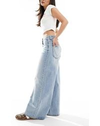 Stradivarius - Jeans A Fondo Ampio Con Dettaglio A Cuore Lavaggio Chiaro - Lyst