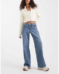 Hollister - Vaqueros De Talle Bajo Y Corte Holgado Con Lavado Azul Claro Y Detalle Bordado De - Lyst