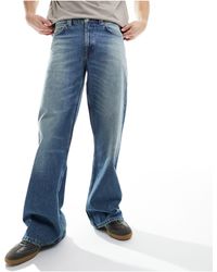 ASOS - Jeans a zampa lavaggio chiaro - Lyst