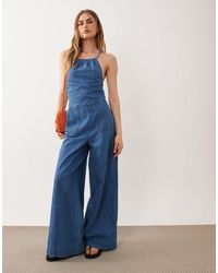 ASOS - Halter Neck Denim Jumpsuit With Patch Pockets - Lyst