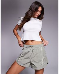 Nike - – wind runner – gewebte shorts - Lyst
