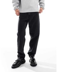 Carhartt - – newel – locker geschnittene, schmal zulaufende jeans - Lyst