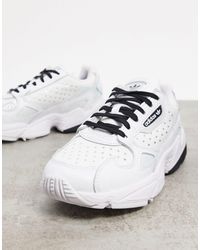 adidas originals white and navy falcon trainers