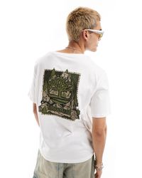 Timberland - T-shirt oversize bianca con logo mimetico sul retro - Lyst