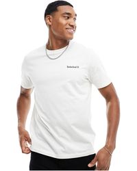 Timberland - T-shirt sporco con scritta piccola del logo - Lyst