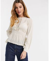 cream peplum blouse