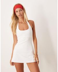 4505 - Active Halter Neck Tennis Dress With Under Shorts - Lyst