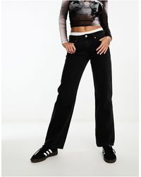 Weekday - Arrow - jeans dritti regular fit a vita bassa neri - Lyst