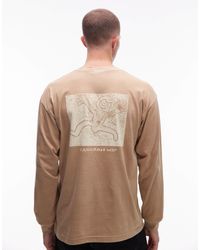 Carhartt - Terrestrial - t-shirt manches longues ample à motif - beige - Lyst