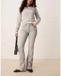 Gina Tricot - Jeans Elasticizzati Bootcut A Zampa A Vita Bassa Slavato - Lyst