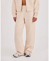 CERNUCCI - Knitted Embroidered Logo Wide Leg Jogger - Lyst