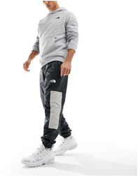 The North Face - Training Mountain Athletics Wind Track joggers - Lyst