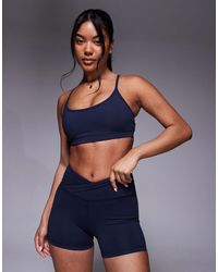 4505 - Icon Light Support Sports Bra With Adjustable Straps - Lyst