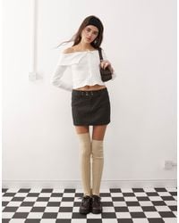 Collusion - Mini-jupe à taille basse et fines rayures - noir - Lyst