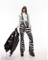 TOPSHOP - Sno - pantaloni a zampa da sci con stampa zebrata e bretelle - Lyst