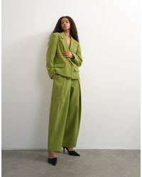 TOPSHOP - Pantalon large à pli sur le devant olive - Lyst