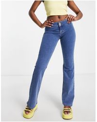TOPSHOP - Low Rise Joni Flare Jeans - Lyst
