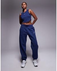 Nike - Joggers Extragrandes De Talle Alto Con Bajos Ajustados Phoenix Fleece De - Lyst