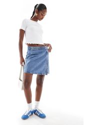 ONLY - Mini-jupe portefeuille en jean - clair - Lyst