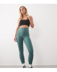 4505 - Leggings Deportivos De Talle Alto Con Bolsillo Interior Y Diseño Moldeador En La Parte Trasera Icon De Petite - Lyst