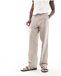 ASOS - Pantalones marrones holgados con bordado inglés y cinturilla elástica - Lyst