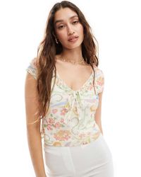 Reclaimed (vintage) - Top Van Mesh Met Kapmouwtjes En Bloemenprint - Lyst