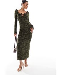 ASOS - Robe longueur mollet à manches longues avec détail noué à l'avant et effet dévoré en dentelle avec volants - kaki - Lyst